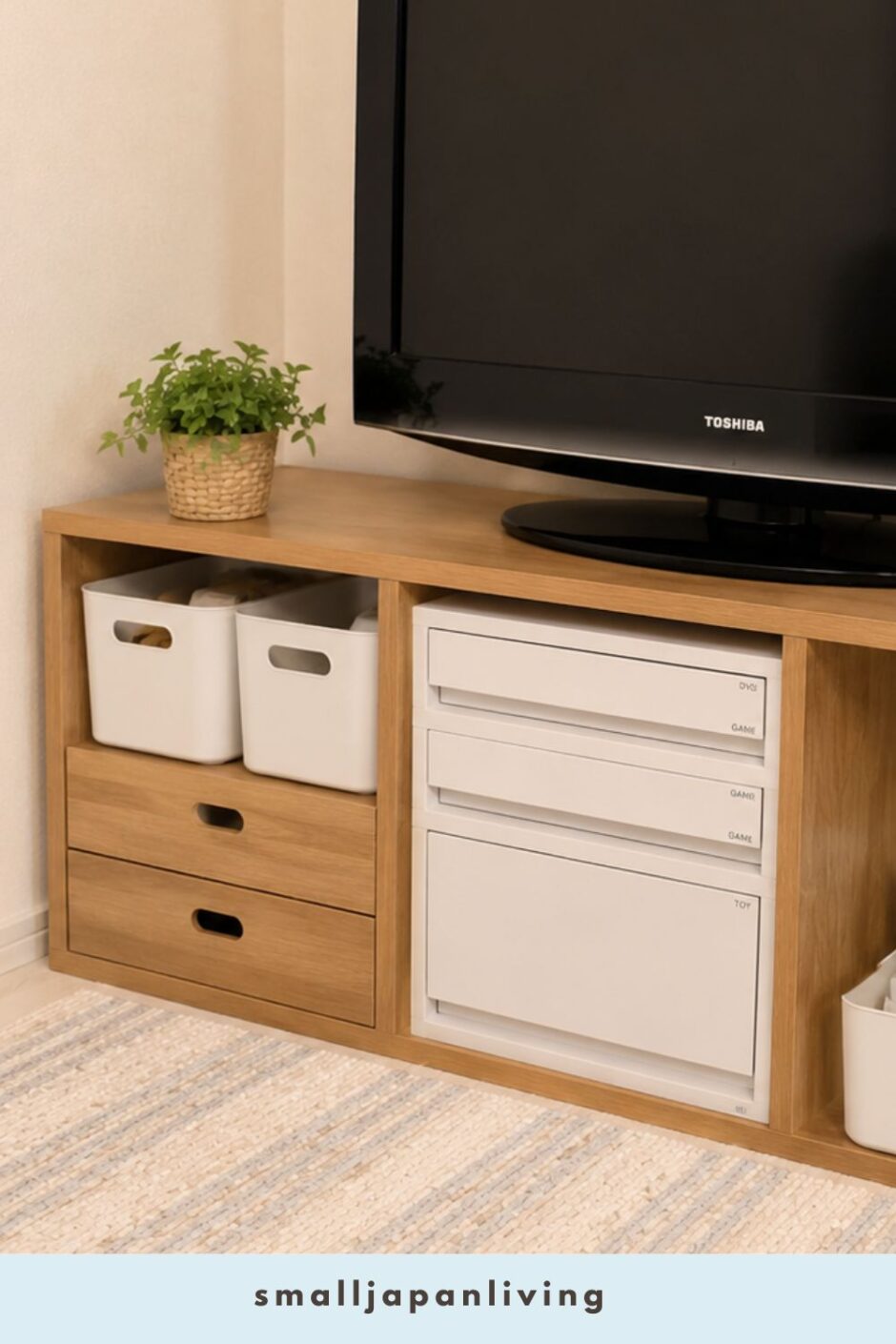 Organized TV stand storage in a small Japanese apartment using simple white bins and drawer organizers